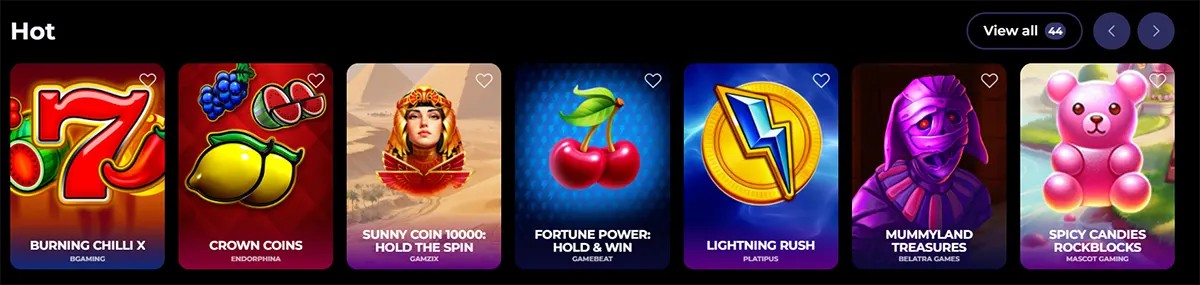 “Hot” games row showing tiles for Burning Chilli X, Crown Coins, Sunny Coin 10000: Hold the Spin, Fortune Power: Hold & Win, Lightning Rush, Mummyland Treasures, and Spicy Candies Rockblocks.