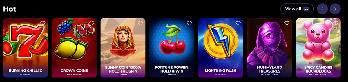 “Hot” games row showing tiles for Burning Chilli X, Crown Coins, Sunny Coin 10000: Hold the Spin, Fortune Power: Hold & Win, Lightning Rush, Mummyland Treasures, and Spicy Candies Rockblocks.
